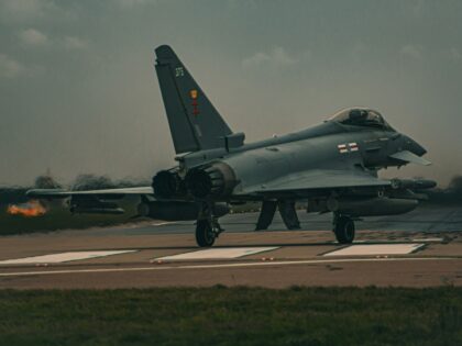 a fighter jet sitting on top of an airport runway RAF Eurofighter Typhoon RAF Coningsby