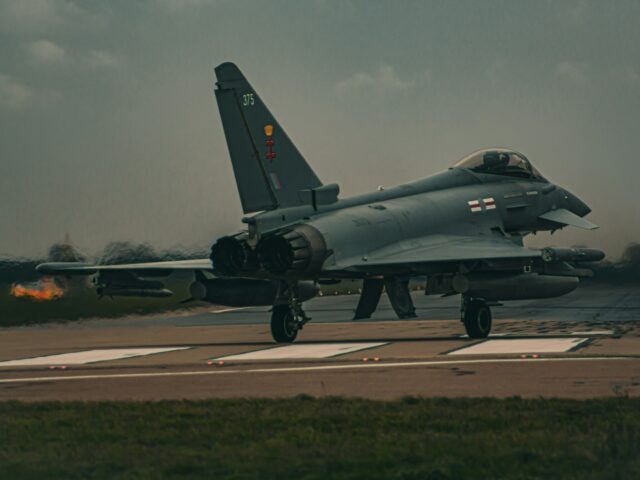 a fighter jet sitting on top of an airport runway RAF Eurofighter Typhoon RAF Coningsby