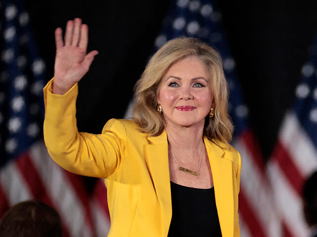 US Sen. Marsha Blackburn (R-TN) waves as she arrives for a town hall with former US Presid