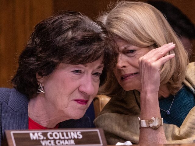 Senator Lisa Murkowski, a Republican from Alaska, right, speaks to Senator Susan Collins,