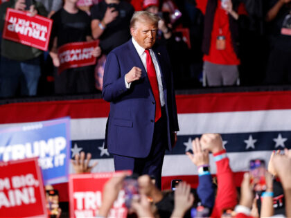 Former US President and Republican presidential candidate Donald Trump walks on stage duri