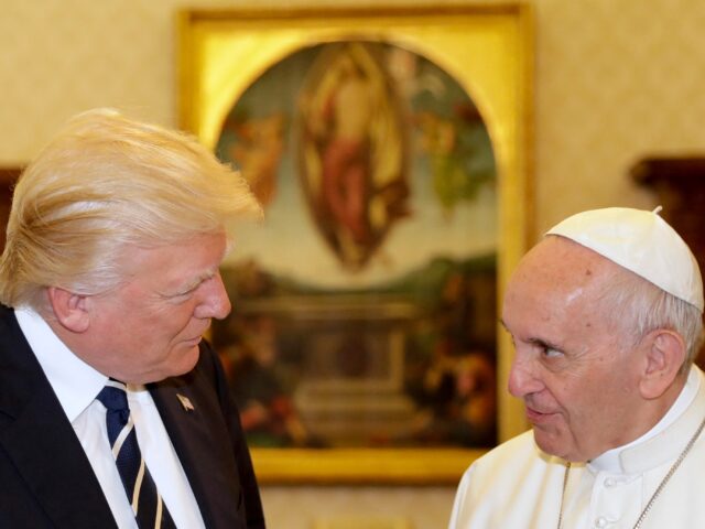 Pope Francis (R) meets with US President Donald Trump during a private audience at the Vat