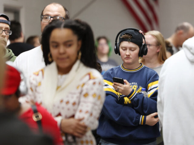 People wait in line to vote at a polling center on Election Day November 5, 2024, in Pahru