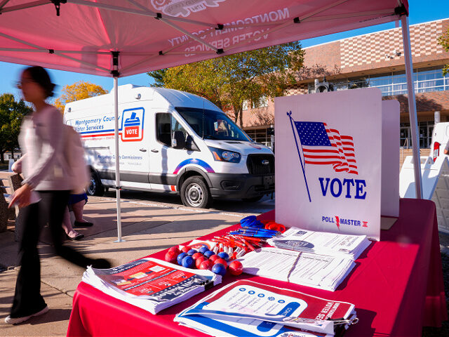 A person walks past Montgomery County's voter services van in King of Prussia, Pa., Tuesda