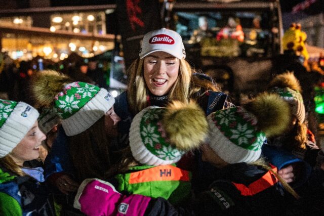 American Mikaela Shiffrin greets members of a junior ski team during the Alpine World Cup