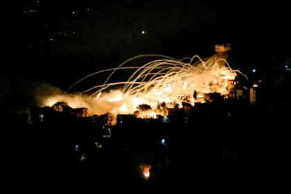 An explosion lights up the night sky over the south Lebanon town of Khiam