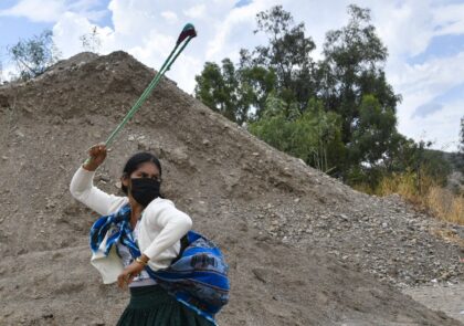 An Indigenous woman supporter of former Bolivian president Evo Morales trains with a huara