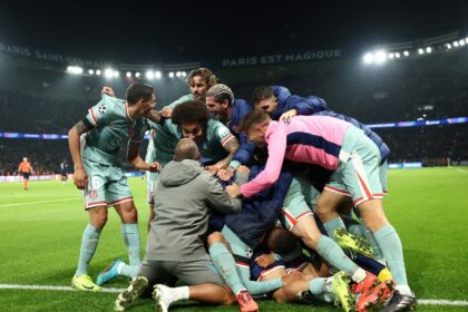 Atletico Madrid players celebrate after Angel Correa's late goal against Paris Saint-Germa