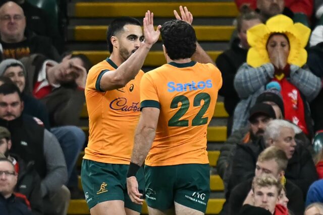 Australia full-back Tom Wright (L) celebrates with Ben Donaldson after scoring his third t