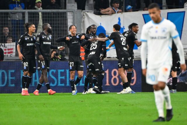 Auxerre players celebrate at the Stade Velodrome as they beat Marseille 3-1