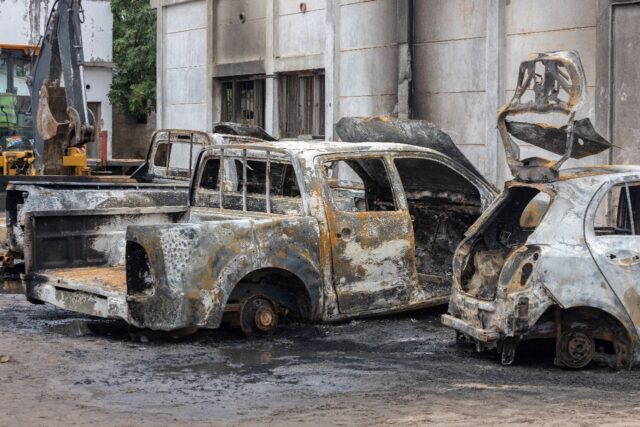 Burnt vehicles littered the streets on Friday