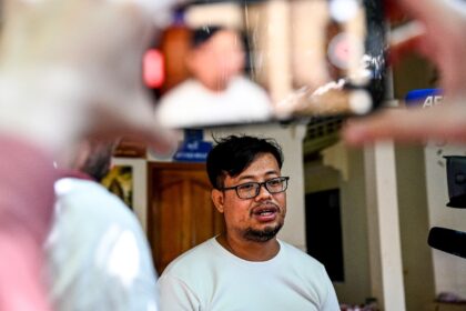 Cambodian journalist Mech Dara, who won an international award for his reporting on scam c