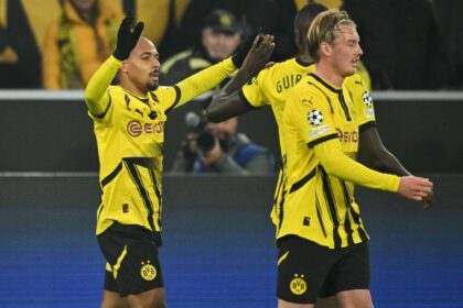 Dortmund forward (L) Donyell Malen celebrates after scoring the only goal against Sturm Gr