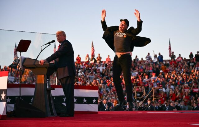 Elon Musk (R), shown joining Donald Trump on stage at a rally in Pennsylvania in October,