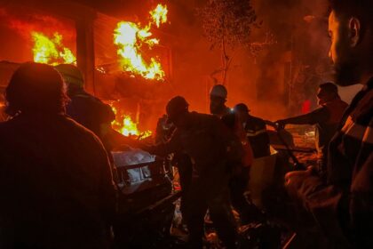 Emergency services fight flames at the site of the Israeli strike on central Beirut