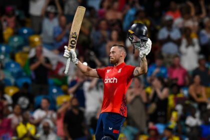 England's Phil Salt celebrates his century during victory West Indies at Kensington Oval o