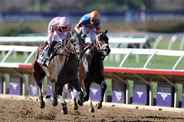 Flavien Prat aboard Sierra Leone passes Fierceness ridden by John Velazquez to win the Bre