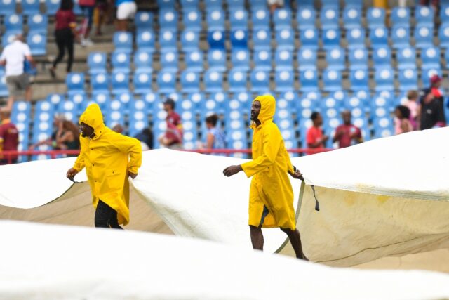 Ground staff cover the field in Saint Lucia during the West Indies v England T20 internati