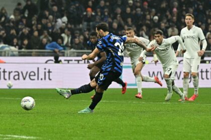 Hakan Calhanoglu's missed penalty allowed Napoli to leave the San Siro with a 1-1 draw