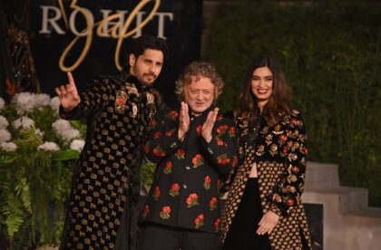 Indian designer Rohit Bal (center) gestures at his fashion show in Mumbai in 2019