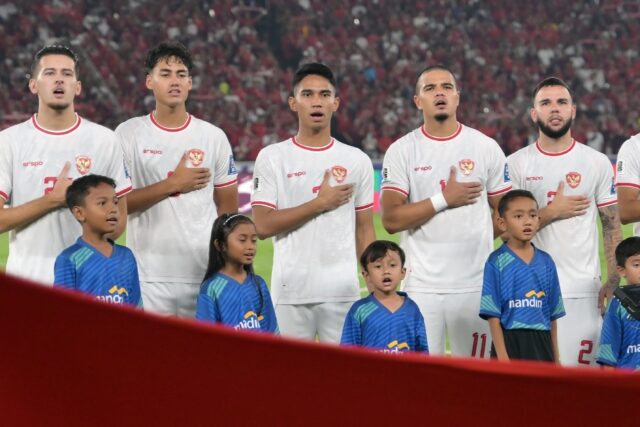 Indonesia's players sing the national anthem ahead of a World Cup qualifier