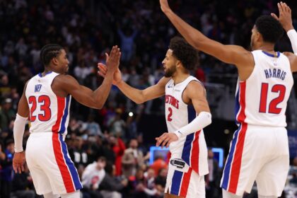 Jaden Ivey and Cade Cunningham of the Detroit Pistons high five during the fourth quarter