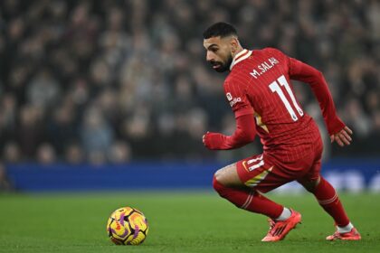 Liverpool star Mohamed Salah in possession during a Premier League match against Aston Vil