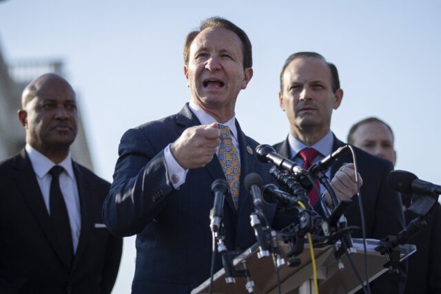 Louisiana Governor Jeff Landry (C) signed the bill requiring the display of the Ten Comman