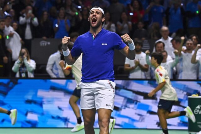 Matteo Berrettini celebrates winning against Botic van de Zandschulp in the opening rubber