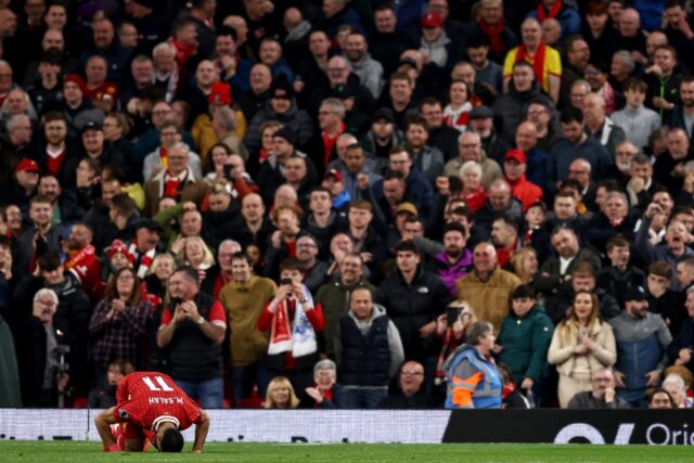 Mohamed Salah celebrates scoring the winner for Liverpool against Brighton.