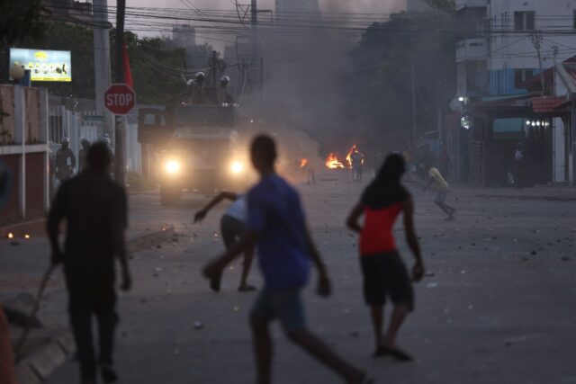 Opposition supporters clash with police after the disputed election