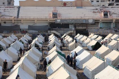 Palestinians displaced by the ongoing war in Gaza shelter in tents at Palestine Stadium in