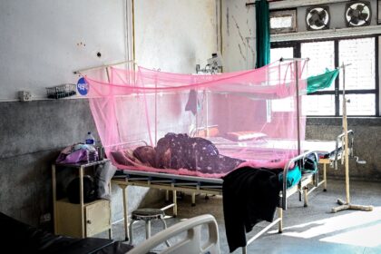 A patient undergoes treatment for dengue in Nepal, where more than 28,000 have been infect