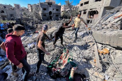 People search the rubble for people missing after an Israeli strike in Beit Lahia