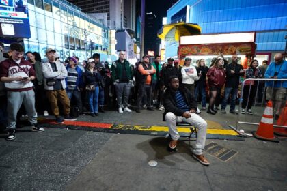 People watch election results at Times Square in New York on November 5, 2024