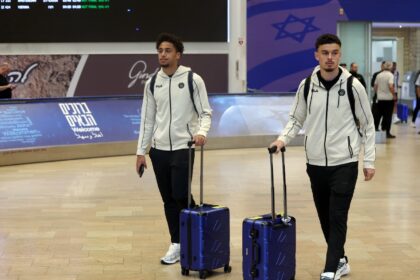 Players from Israel's Maccabi Tel Aviv football club arrive at Ben Gurion International fr