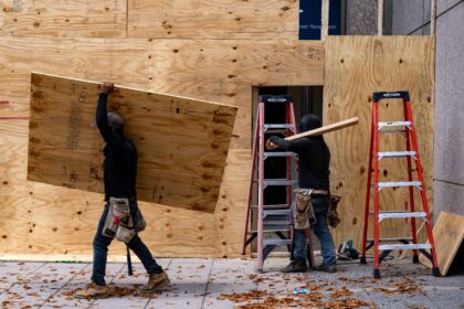 Storefronts and buildings are boarded up along Pennsylvania Avenue near the White House on