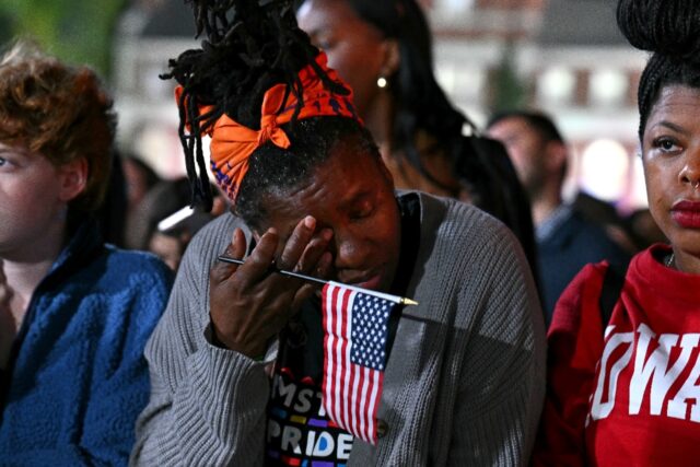 Supporters at an election night event for US Vice President and Democratic presidential ca