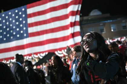 Supporters watch election results during an election night event for US Vice President and