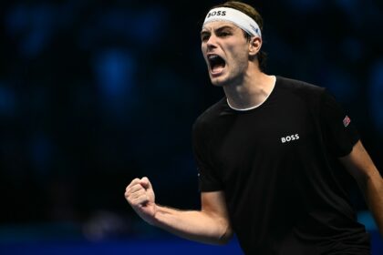 Taylor Fritz celebrates after beating Alexander Zverev at the ATP Finals tennis tournament