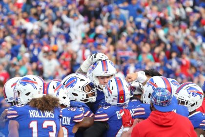 Tyler Bass and Buffalo teammates celebrate his game-winning field goal in the Bills' NFL v