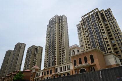 Unfinished apartments at a complex in Xinzheng City in Zhengzhouin 2023. China is looking