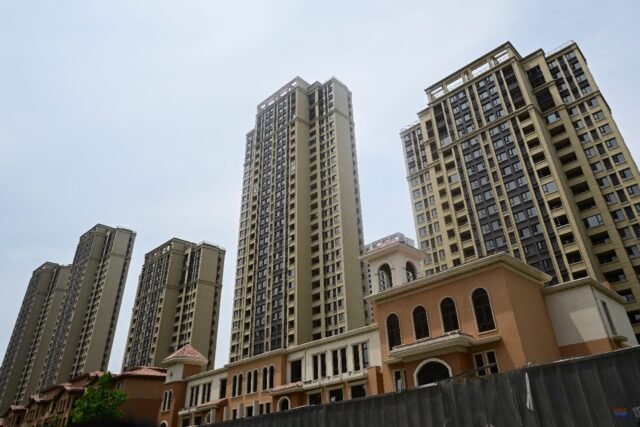 Unfinished apartments at a complex in Xinzheng City in Zhengzhouin 2023. China is looking