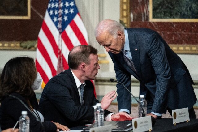 US President Joe Biden confers with his National Security Advisor Jake Sullivan in Washing