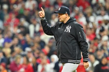 The New York Yankees said they have picked up the contract option to have Aaron Boone rema