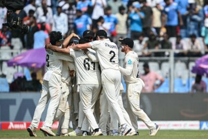 New Zealand's players celebrate after winning the third and final Test in Mumbai