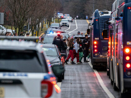 MADISON, WISCONSIN - DECEMBER 16: Students from Abundant Life Christian School are escorte