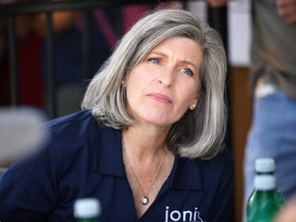 U.S. Senator Joni Ernst eating at Cattlemen's Beef Quarters at the Iowa State Fair in Des