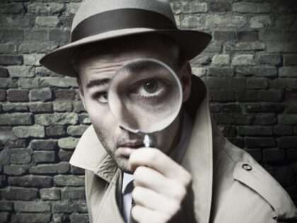 A detective with his magnifying glass