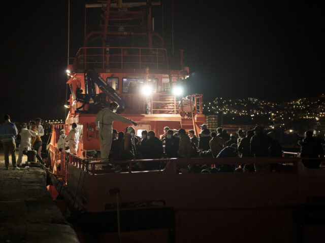 Migrants arrive aboard a Spanish coast guard rescue ship at Arguineguin port, in Gran Cana